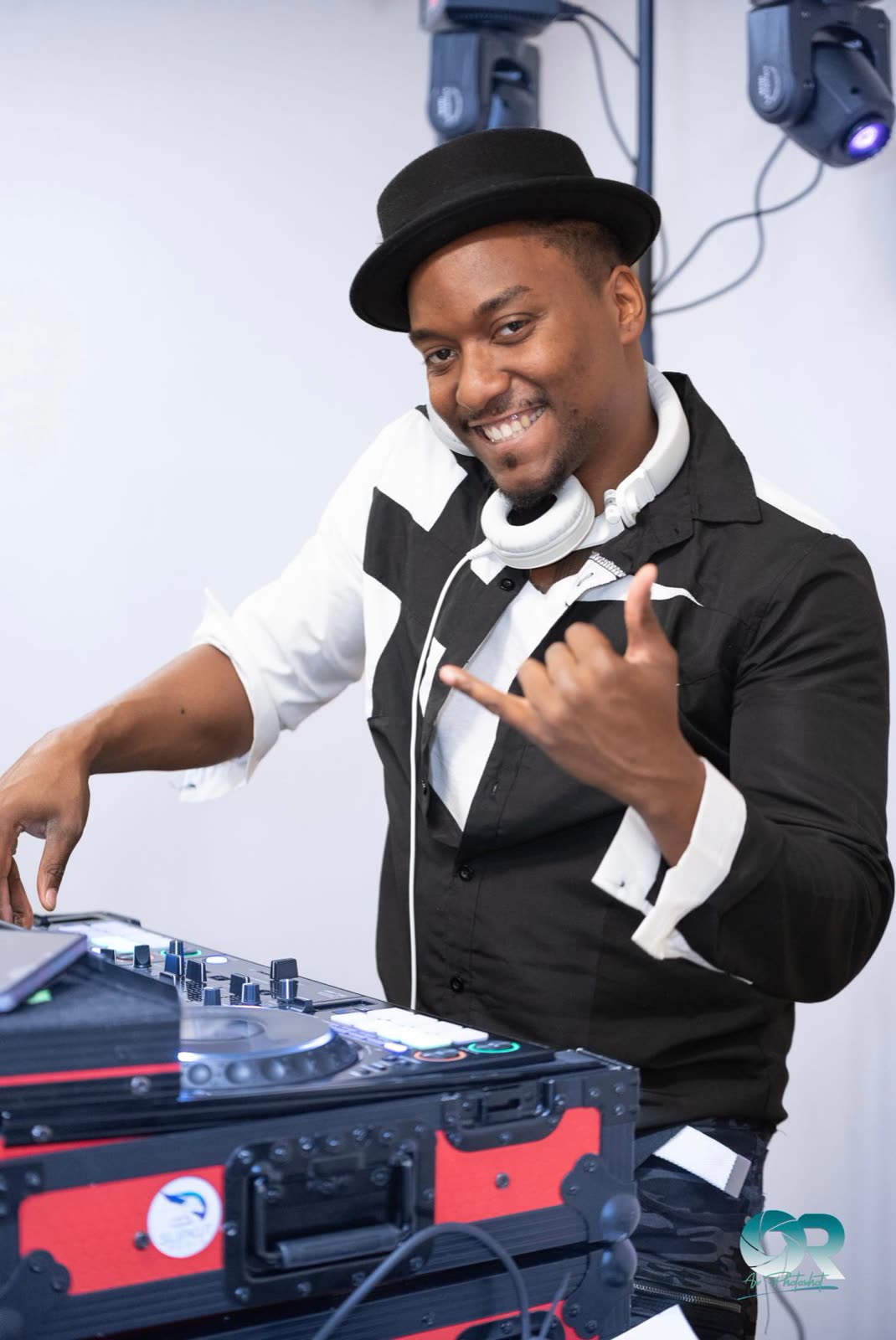 DJ Moefya smiling behind the decks