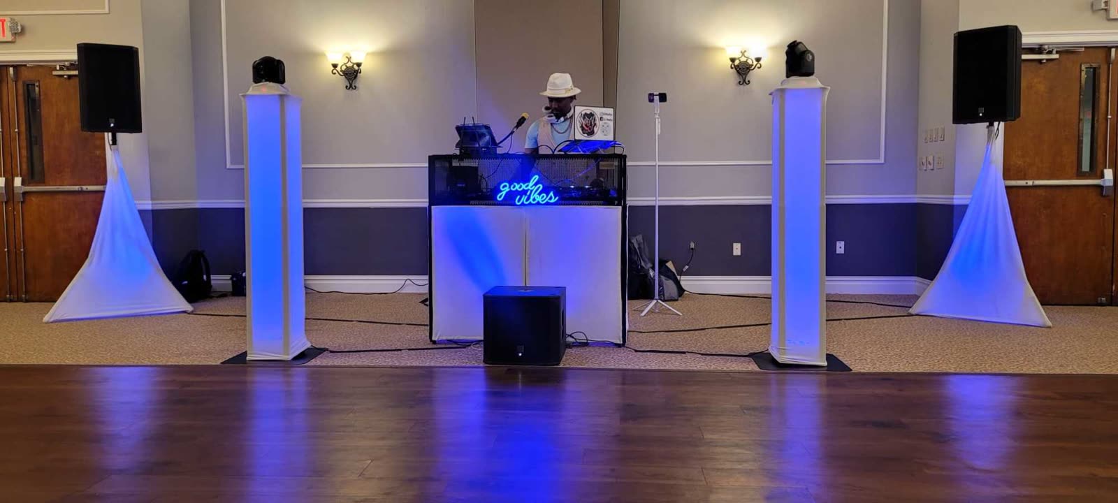 DJ booth with Good Vibes sign
